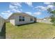 Spacious backyard with verdant grass and a privacy fence, perfect for outdoor activities at 947 Serchio St, Haines City, FL 33844