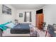 Bedroom featuring wood-look floors, a comfortable bed, and ample natural light at 947 Serchio St, Haines City, FL 33844