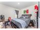 A well-lit bedroom features a large bed with wood floors and a gray curtain at 947 Serchio St, Haines City, FL 33844