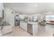 Bright and airy kitchen with modern appliances, ample counter space, and an open layout to the living area at 947 Serchio St, Haines City, FL 33844