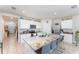 Spacious kitchen with granite countertops, stainless steel appliances, and a large island with seating at 947 Serchio St, Haines City, FL 33844