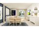 Bright and open-concept living and dining area with contemporary furniture and a sliding glass door at 1301 Acorn Meadow Loop, Eustis, FL 32726