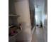 Bathroom with a shower-tub combo, tiled floors, and a window providing natural light at 1529 Indiana St, Orlando, FL 32805