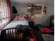 Image of a bedroom with a bed, closet with shoes, an AC unit, and a stocking at 1529 Indiana St, Orlando, FL 32805