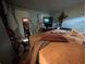 Showing a bedroom containing a bed, AC unit, television and personal belongings at 1529 Indiana St, Orlando, FL 32805