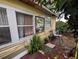 Exterior of house with window, plants, bikes and other miscellaneous items at 1529 Indiana St, Orlando, FL 32805