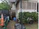 Side view of a house, showcasing a yard with outdoor items and features at 1529 Indiana St, Orlando, FL 32805