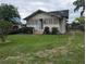 Single story home with a well-manicured lawn and an open door in a neighborhood setting at 1529 Indiana St, Orlando, FL 32805