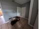 Neutral hallway with tile floors featuring a small wood table against the wall at 1529 Indiana St, Orlando, FL 32805