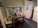 Functional interior showcasing a desk and chair, complemented by a colorful window and a refrigerator in the background at 1529 Indiana St, Orlando, FL 32805