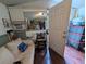 View of the living room with a white couch and a look into another room at 1529 Indiana St, Orlando, FL 32805