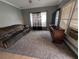 Spacious living room features a large window, modern TV, and comfortable seating arrangement at 1529 Indiana St, Orlando, FL 32805