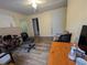 Spacious living room with laminate floors, neutral paint, and bright lighting at 1529 Indiana St, Orlando, FL 32805