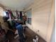 Enclosed porch with an assortment of items, plus a window at 1529 Indiana St, Orlando, FL 32805