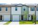 Charming townhome with attached garage and well-maintained lawn at 3273 Vesara Dr, Davenport, FL 33837