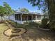 Back yard featuring vinyl fencing, nice landscaping, and screened porch at 3446 Country Manor Dr, Port Orange, FL 32129