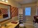 Bathroom featuring shower over tub and single sink vanity at 3446 Country Manor Dr, Port Orange, FL 32129