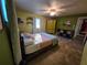 Spacious bedroom with tile flooring, a ceiling fan, and natural lighting from a window at 3446 Country Manor Dr, Port Orange, FL 32129