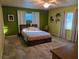 Bright bedroom with tile floors, natural light, and warm color scheme at 3446 Country Manor Dr, Port Orange, FL 32129
