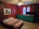 Bedroom with painted accent wall and custom-built desk at 3446 Country Manor Dr, Port Orange, FL 32129
