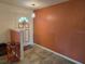 Inviting entrance with decorative front door, tile flooring, and fresh, neutral paint at 3446 Country Manor Dr, Port Orange, FL 32129