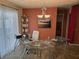 Bright office space with tile floors, a glass desk, and a view of the backyard at 3446 Country Manor Dr, Port Orange, FL 32129