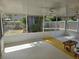 Screened porch features two ceiling fans and view of the yard at 3446 Country Manor Dr, Port Orange, FL 32129