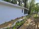 Exterior shot of side yard features vinyl fence and nice landscaping at 3446 Country Manor Dr, Port Orange, FL 32129