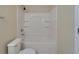 Bathroom featuring a single vanity, updated fixtures, and tub with tile surround at 2415 Brownwood Dr, Mulberry, FL 33860