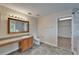 En suite bathroom featuring vanity with a marble shower and open doorway to walk in closet at 2415 Brownwood Dr, Mulberry, FL 33860