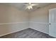 Neutral bedroom featuring a ceiling fan and carpeted flooring at 2415 Brownwood Dr, Mulberry, FL 33860