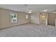 Expansive bedroom with neutral decor, plush carpeting, and bright natural light at 2415 Brownwood Dr, Mulberry, FL 33860