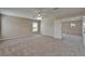 Bedroom with natural light, showing plush carpeting and access to en suite bathroom at 2415 Brownwood Dr, Mulberry, FL 33860