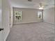 Neutral bedroom offers generous space, soft carpeting and bright natural light at 2415 Brownwood Dr, Mulberry, FL 33860