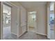 Hallway with doors leading to carpeted bedrooms in a neutral color scheme at 2415 Brownwood Dr, Mulberry, FL 33860