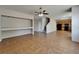 Expansive living space with open shelving, staircase, and kitchen access, ideal for entertaining at 2415 Brownwood Dr, Mulberry, FL 33860