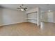 Spacious living room with a ceiling fan, display shelving and tile floors, perfect for gatherings at 2415 Brownwood Dr, Mulberry, FL 33860