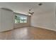 Bright living room featuring large windows and tile flooring, offering a flexible layout at 2415 Brownwood Dr, Mulberry, FL 33860