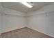 Spacious walk-in closet with wire shelving, neutral carpeting, and ample room for storage at 2415 Brownwood Dr, Mulberry, FL 33860