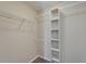 Spacious walk-in closet featuring built-in shelving and ample hanging space for storage at 2415 Brownwood Dr, Mulberry, FL 33860