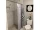 Bright bathroom featuring a shower with marble tiling and a lovely decor at 3601 Ne 24Th Ct, Ocala, FL 34479