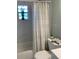 Cozy bathroom with tub and shower with updated shower curtain at 3601 Ne 24Th Ct, Ocala, FL 34479