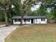 Charming home with a well-maintained front yard and mature trees offers great curb appeal at 3601 Ne 24Th Ct, Ocala, FL 34479