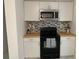 Well-equipped kitchen with modern appliances, plenty of storage and stylish backsplash at 3601 Ne 24Th Ct, Ocala, FL 34479