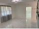 Bright and airy living room with marble flooring, perfect for relaxation and entertaining at 3601 Ne 24Th Ct, Ocala, FL 34479