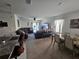 Open-concept living space featuring a cozy living room and a dining area at 1204 Berry Ln, Davenport, FL 33837