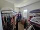 Well-organized walk-in closet with ample storage space and natural light at 1204 Berry Ln, Davenport, FL 33837