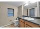 Bathroom featuring single sink vanity, toilet and view of shower at 1480 E Davidson St, Bartow, FL 33830