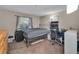 Bedroom with a bed, desk, and good natural light at 1480 E Davidson St, Bartow, FL 33830