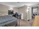 Bedroom with metal bed frame, desk, and carpeting at 1480 E Davidson St, Bartow, FL 33830